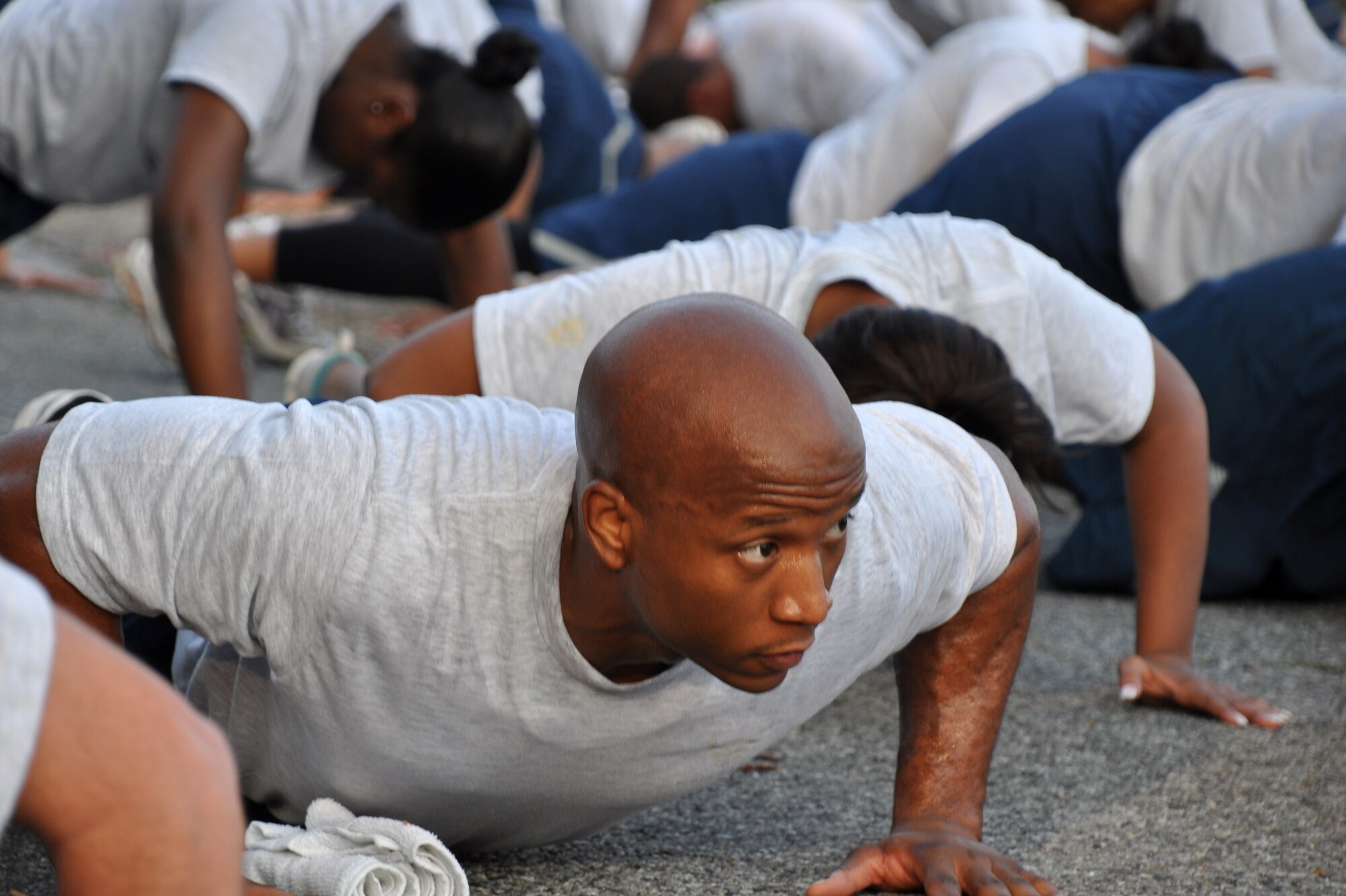 Second Lt. Travares Dozier, 96th Force Support Squadron, performs push-ups at Station 1 during the 96th Air Base Wing Fitness Event June 18. Hosted by the 96th Medical Group, the fitness event touted a medical theme. (U.S. Air Force photo/Staff Sgt. Stacia Zachary)