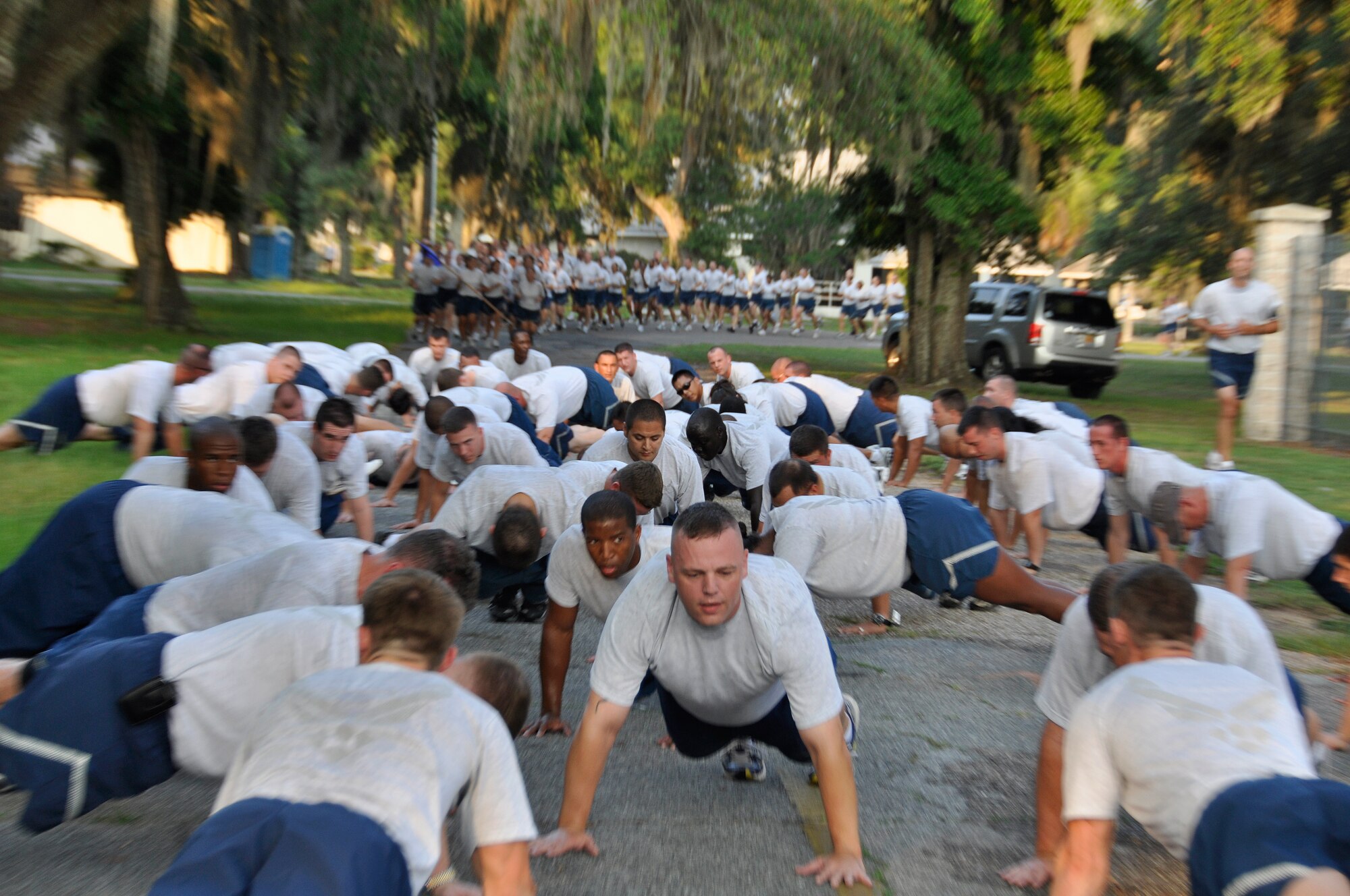 Airman were tested with a 3-mile run and four fitness stations along the route during the 96th Air Base Wing Fitness Event June 18. Hosted by the 96th Medical Group, the fitness event touted a medical theme. The 3-mile run was broken up with four stations with regular fitness exercises and also challenge exercises such as litter crawls, Self-Aid Buddy Care, a bedpan fill and a race to don personal protective equipment. (U.S. Air Force photo/Staff Sgt. Stacia Zachary)
