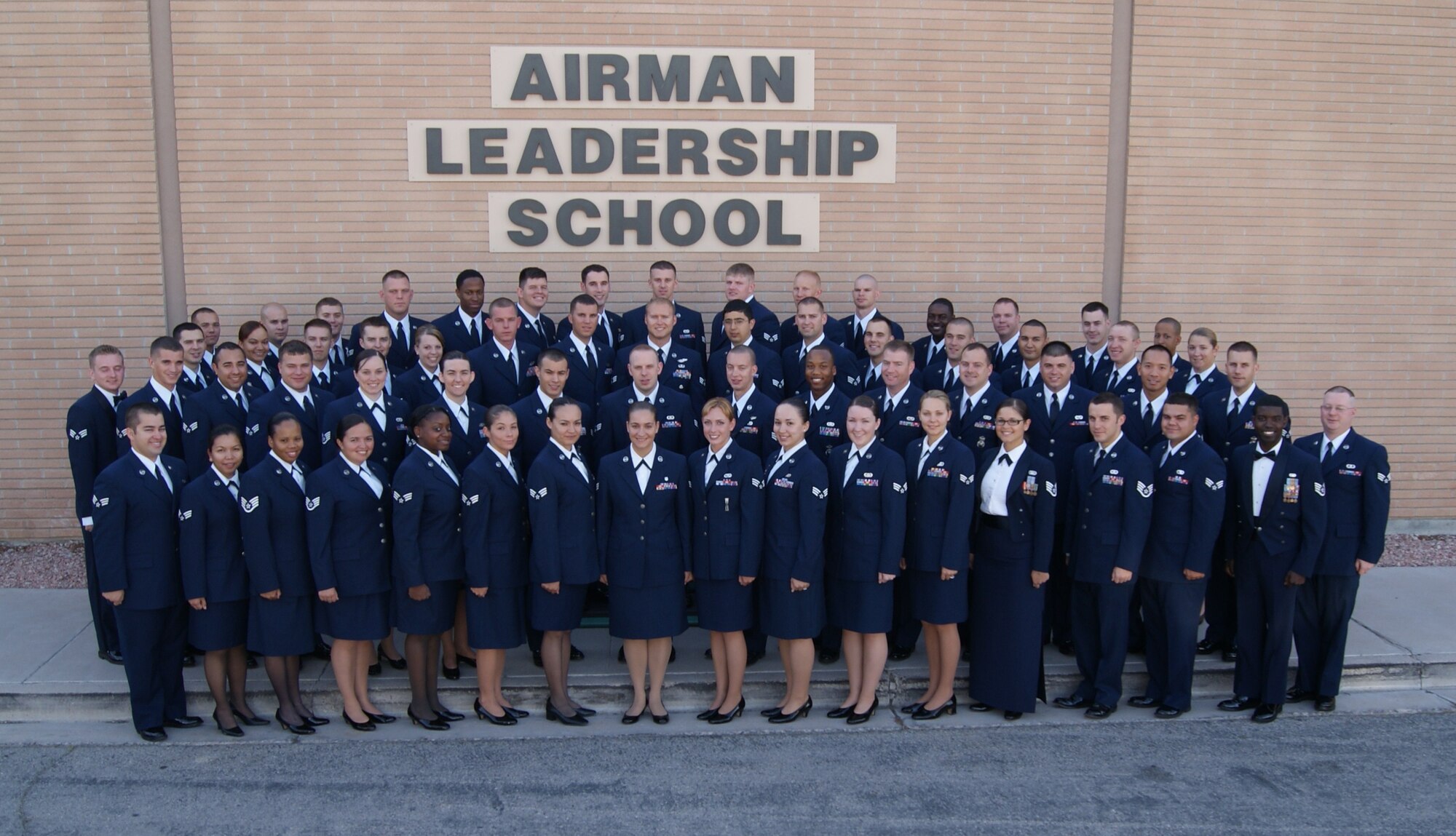 Airman Leadership School class 10-E pose for a picture in front of the ALS. The following Airmen graduated Airman Leadership School from the officers club June 17. There were five distinguished graduates, one John Levitow Award winner, one academic award winner and one commandant award winner. 
