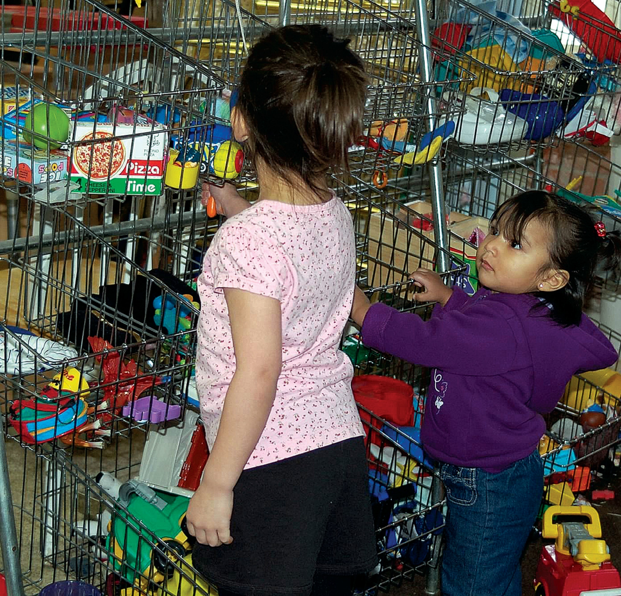 Warren children look through the toy section of the recently renovated Airman's Attic. (U.S. Air Force photo by Julie Tims)