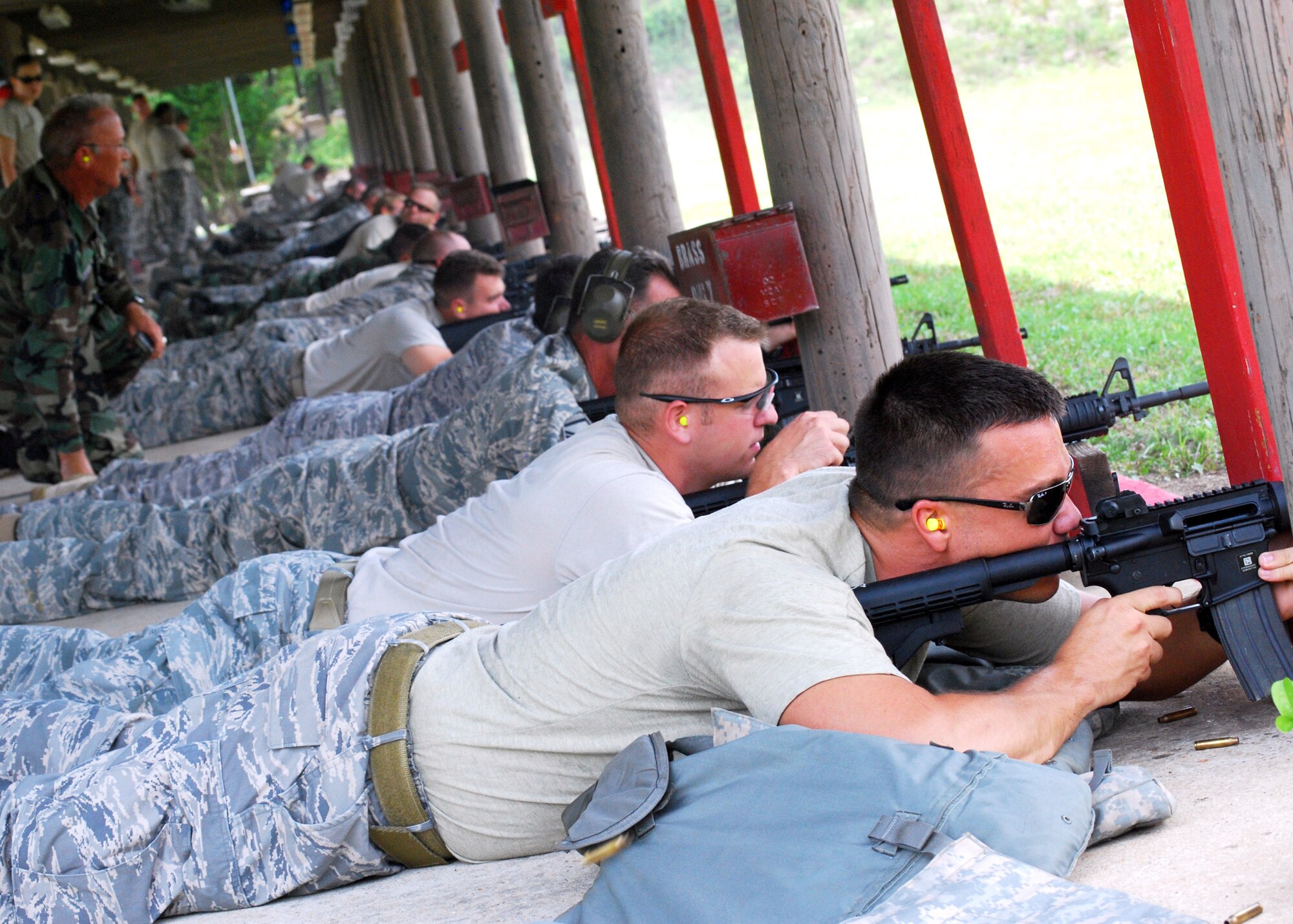 Reserve Airmen from Duke Field's  919th Civil Engineer Squadron commence firing at the Hurlburt Field, Fla., firing range June 5.  The reservist engineers must qualify annually to meet deployment readiness requirements. (U.S. Air Force photo/Tech. Sgt. Cheryl Foster)