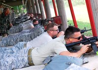Reserve Airmen from Duke Field's  919th Civil Engineer Squadron commence firing at the Hurlburt Field, Fla., firing range June 5.  The reservist engineers must qualify annually to meet deployment readiness requirements. (U.S. Air Force photo/Tech. Sgt. Cheryl Foster)