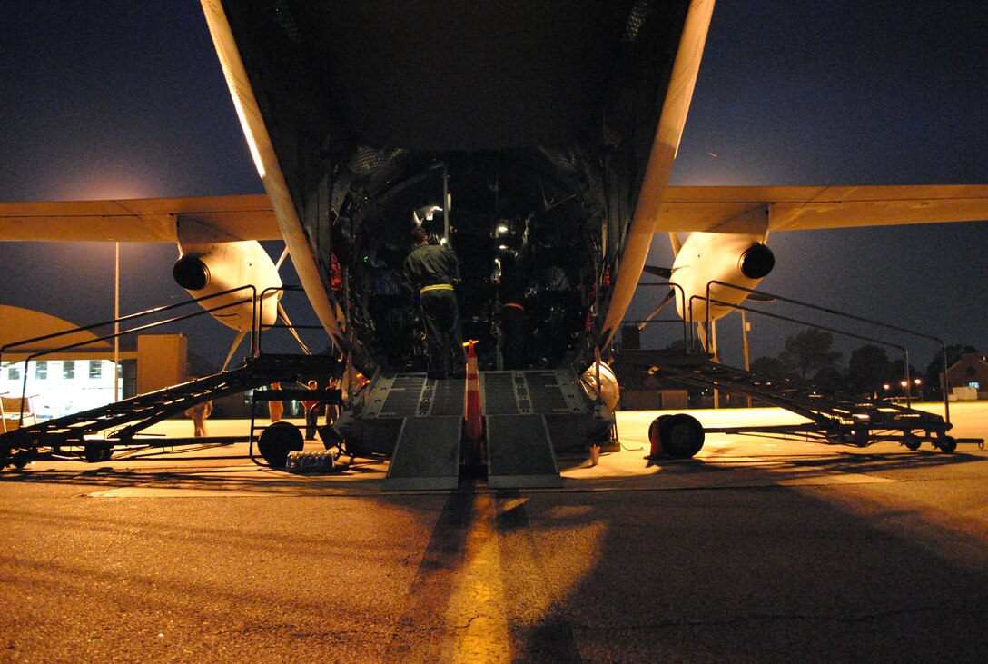 A C-27J Spartan sits on the flightline filled with mock patients and aeromedical evacuation personnel during a production qualification test June 8, 2010, at Scott Air Force Base, Ill. The timed emergency evacuations of patients and aircrew through all doors and an emergency escape hatch on top of the airframe. (U.S. Air Force photo/Bekah Clark)
