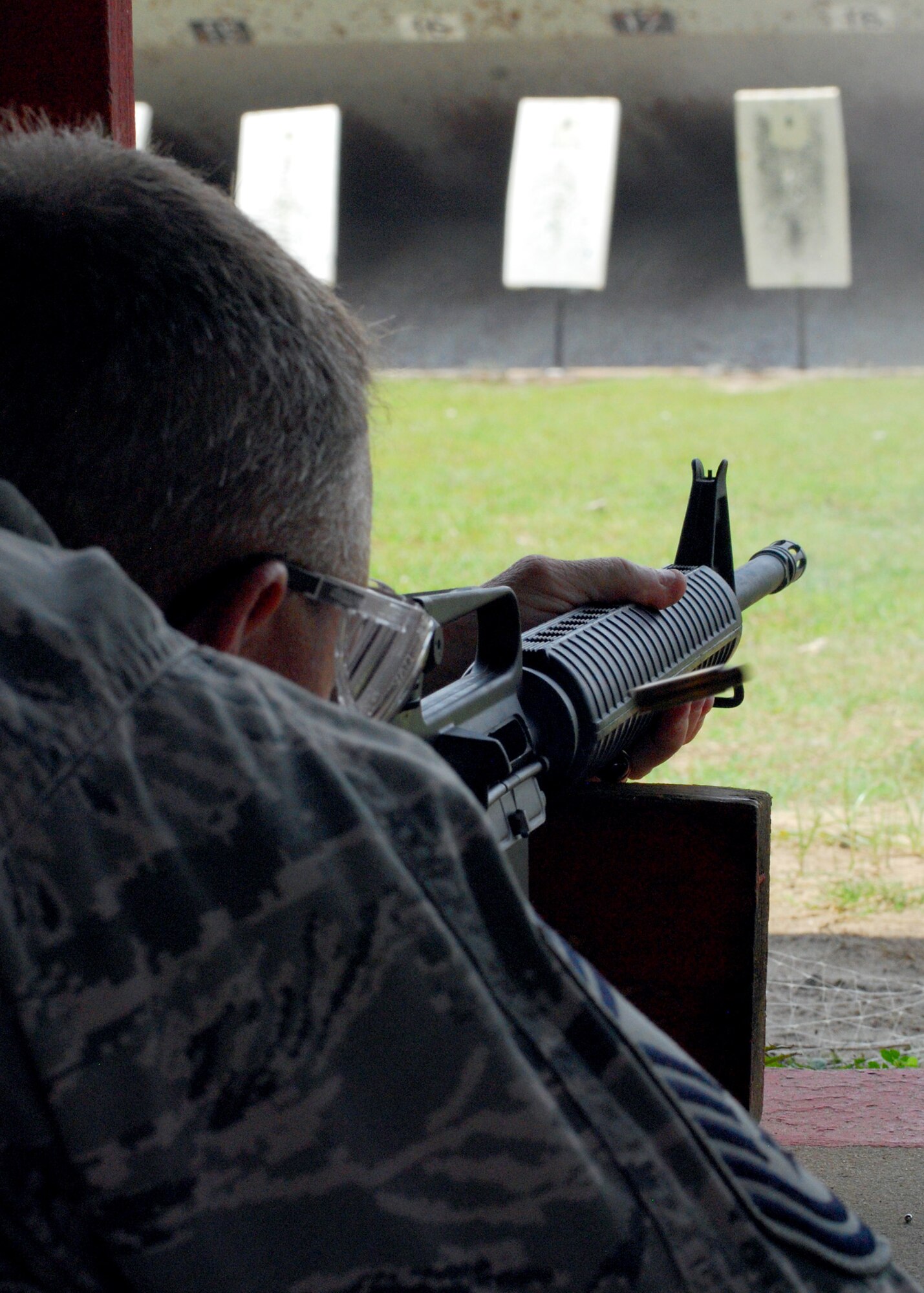 Air Force Reserve Chief Master Sgt. Bill Posey, 919th Civil Engineer Squadron, fires on his target at the Hurlburt Field firing range June 5.  The Duke Field reservist engineers must qualify annually to meet deployment readiness requirements. (U.S. Air Force photo/Tech. Sgt. Cheryl Foster)