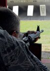 Air Force Reserve Chief Master Sgt. Bill Posey, 919th Civil Engineer Squadron, fires on his target at the Hurlburt Field firing range June 5.  The Duke Field reservist engineers must qualify annually to meet deployment readiness requirements. (U.S. Air Force photo/Tech. Sgt. Cheryl Foster)