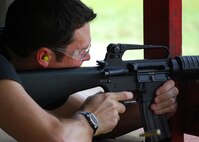 Air Force Reserve Senior Airman Andrew Gard, 919th Civil Engineer Squadron, fires down range at his target at the Hurlburt Field firing range June 5. The Duke Field reservist engineers must qualify annually to meet deployment readiness requirements. (U.S. Air Force photo/Tech. Sgt. Cheryl Foster)