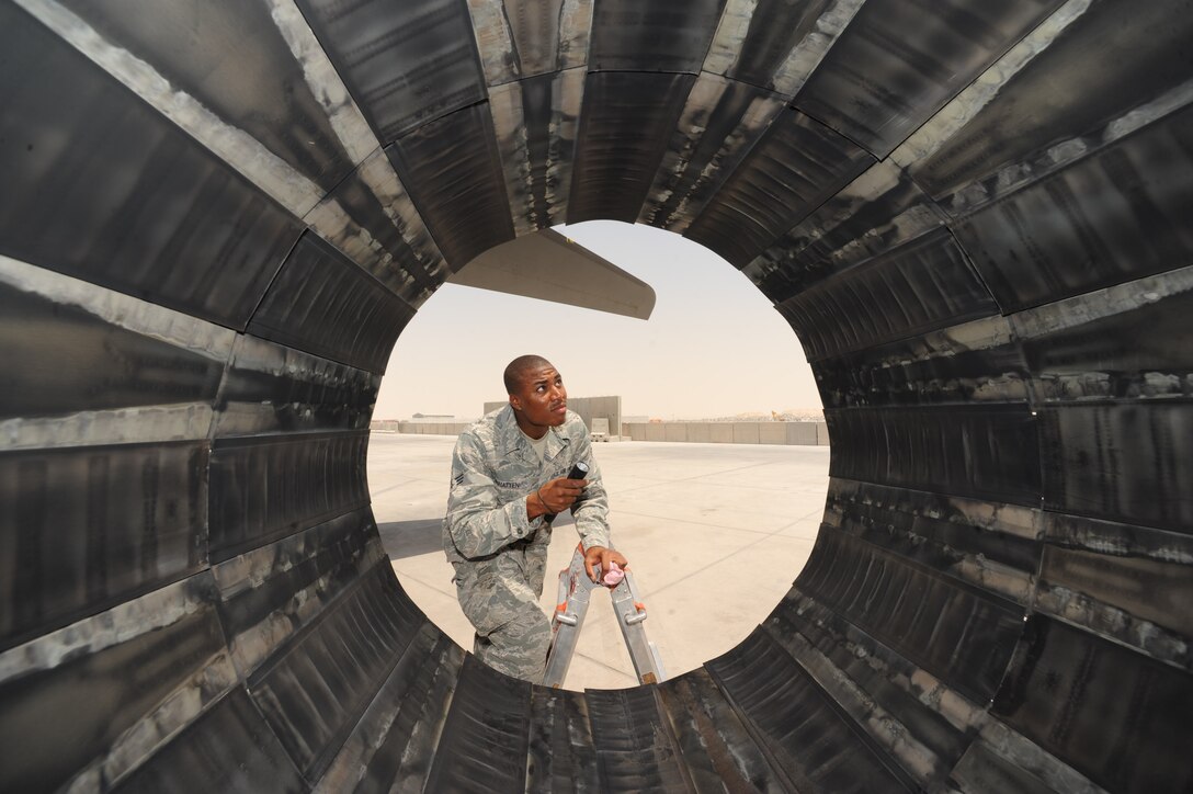 Senior Airman DeQuan McHatten, 34th Aircraft Maintenance Unit crew chief, performs a pre-flight inspection on a B1-B Lancer aircraft exhaust at a non-disclosed Southwest Asia location, June 12, 2010. (U.S. Air Force photo by Tech. Sgt. Michelle Larche)[RELEASED]