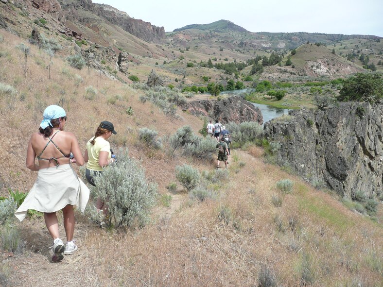 Nine veterans and their Outward Bound instructors hiked to a U.S. flag located atop a steep cliff, a prominent feature visible from the Lower Deschutes River, Ore. On the hike, students found that the return trip down on a steep hike can be just as challenging as the way up. Students attended a free Outward Bound whitewater rafting expedition, June 6 to 10 (U.S. Air Force photo/Capt. Rebecca A. Garcia).