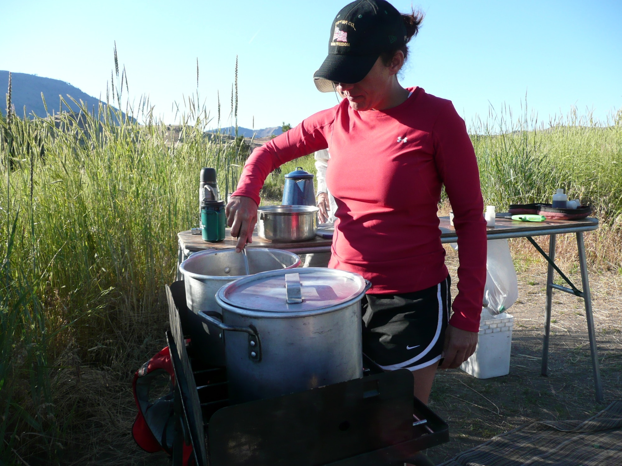 Staff Sergeant Stephanie J. Riotte, Rhode Island National Guard prepares the evening meal for a team of nine veterans who chose to attend the white water rafting course, located on the Lower Deschutes River, OR.  Students on Outward Bound expeditions have daily responsibilities, such as: cook, rigger, navigator/groover and leader. Students attended a free Outward Bound whitewater rafting expedition, June 6 to 10 (U.S. Air Force photo/Capt. Rebecca A. Garcia).