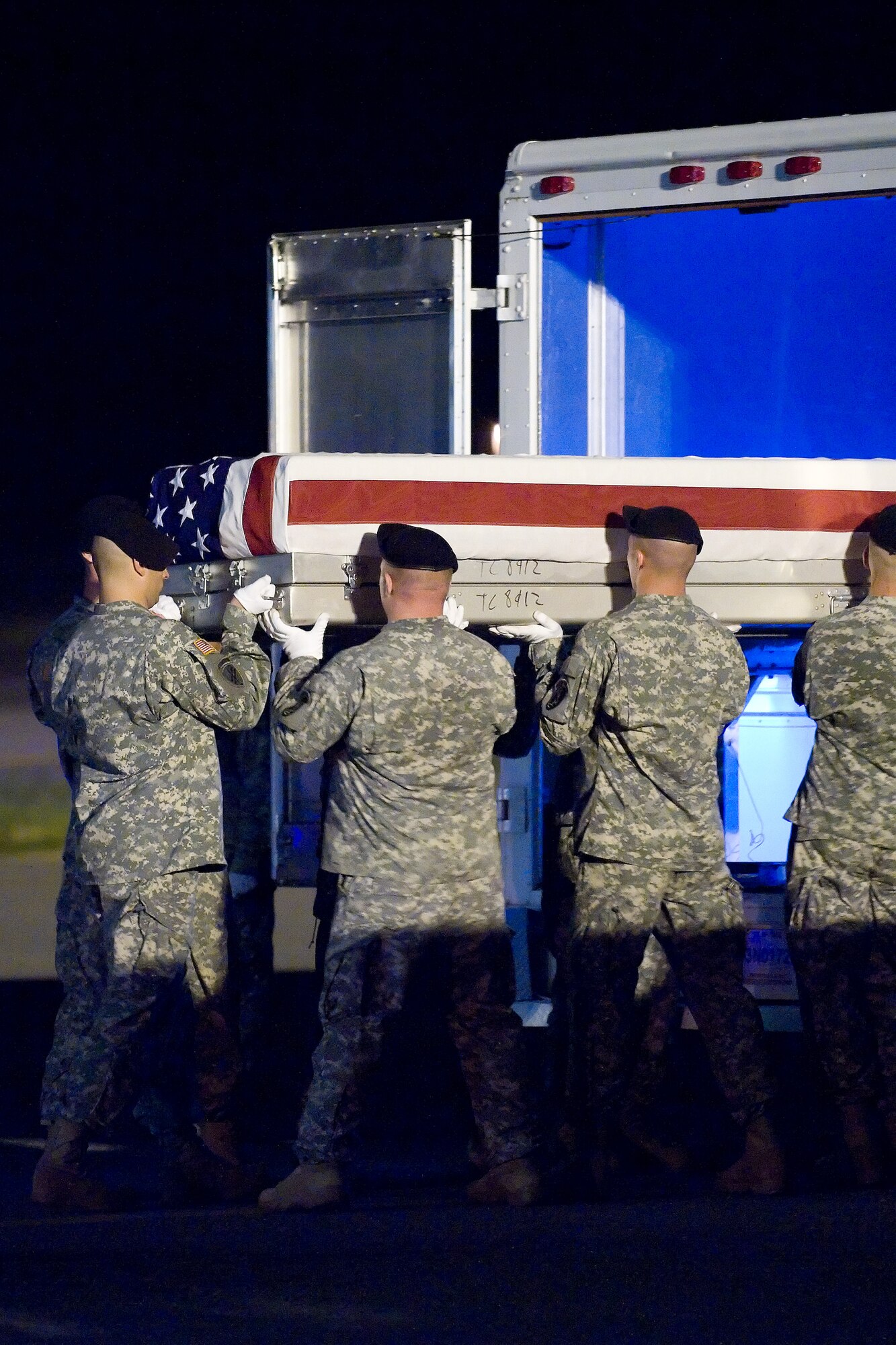 13 June 2010  USAF Photo by Jason Minto.  A U.S. Army carry team transfers the remains of Army SSG Bryan A. Hoover of West Elizabeth, PA at Dover Air Force Base, Del., June 13, 2010.  