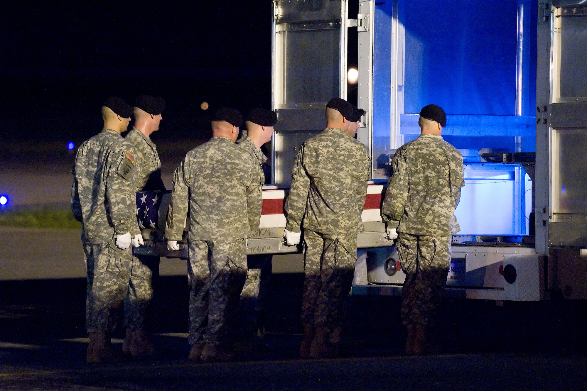 13 June 2010  USAF Photo by Jason Minto.  A U.S. Army carry team transfers the remains of Army SGT Mario Rodriguez of Smithville, TX at Dover Air Force Base, Del., June 13, 2010.  