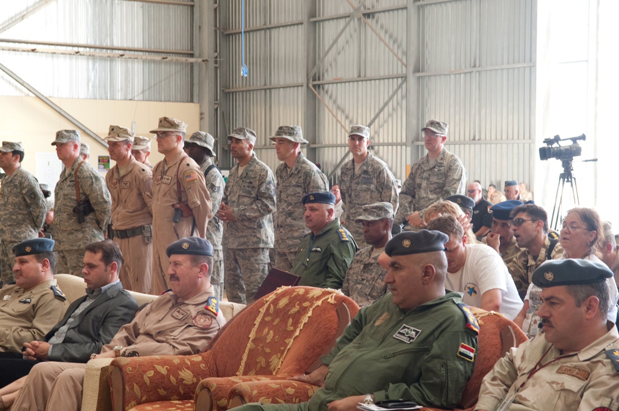 U.S. and Iraqi Air Force members witness the change of command ceremony of Col. Shaun Turner,  who assumed command of the 321st Air Expeditionary Advisory Group at Kirkuk Regional Air Base, Iraq, June 14, 2010. The group's mission is to advise and assist the Iraqi Air Force in developing credible, professional, and enduring capabilities.