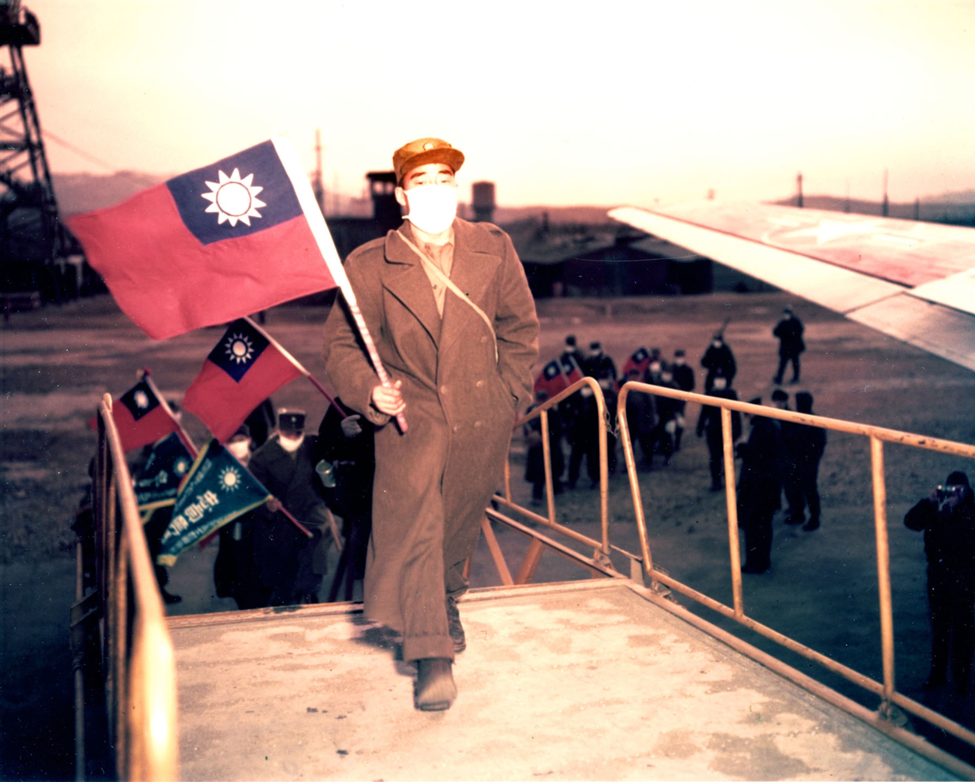 Recently released Chinese POWs carrying Taiwanese flags board a USAF transport in January 1954 for the flight to Taiwan and freedom after renouncing communism. Those communist POWs who returned to China and North Korea faced uncertain futures -- they were regarded as traitors for being captured. (U.S. Air Force photo)