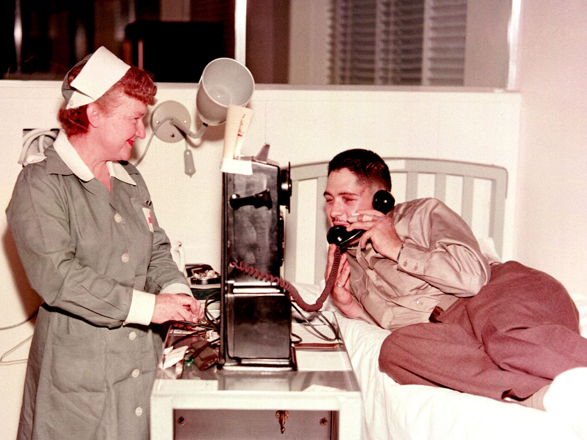 A returned American POW from Ohio makes a call to his family immediately after arriving at Travis Air Force Base, Calif., April 1953. (U.S. Air Force photo)