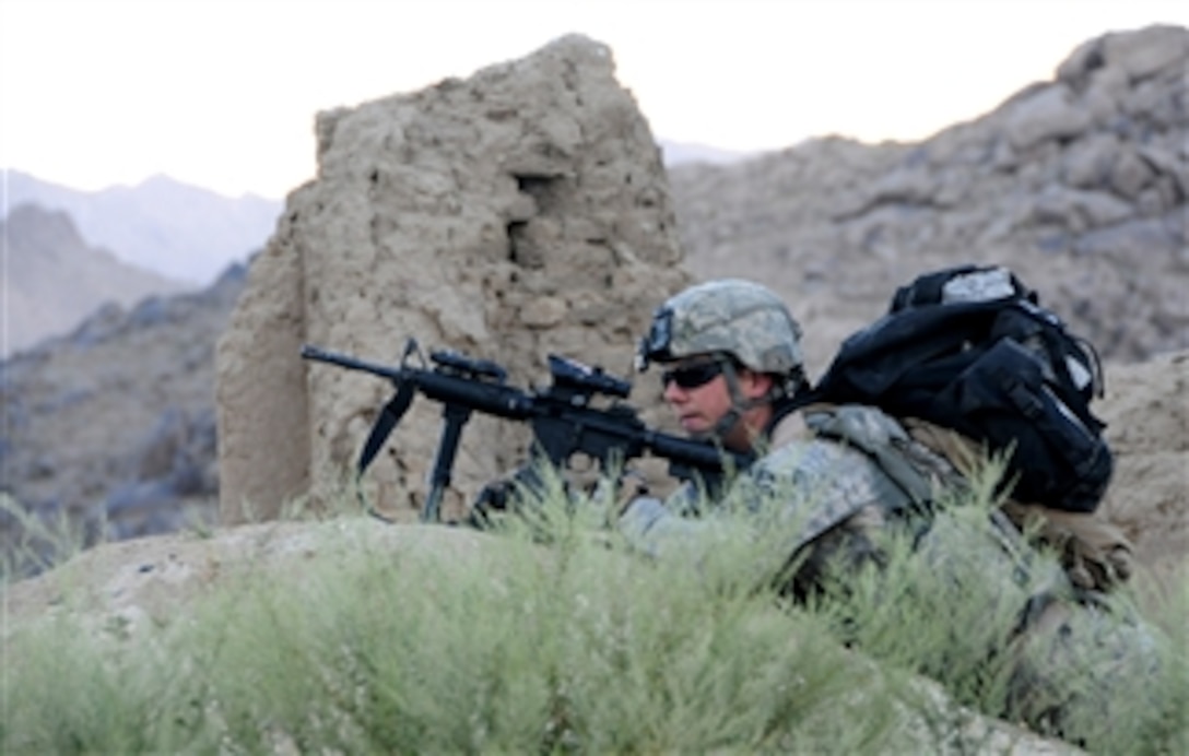 U.S. Army Pfc. Justin Coats, from Red Tank, 1st Platoon, Delta Company, 1st Battalion, 4th Infantry Regiment, keeps watch on a patrol near Forward Operating Base Baylough, Afghanistan, on June 16, 2010.  