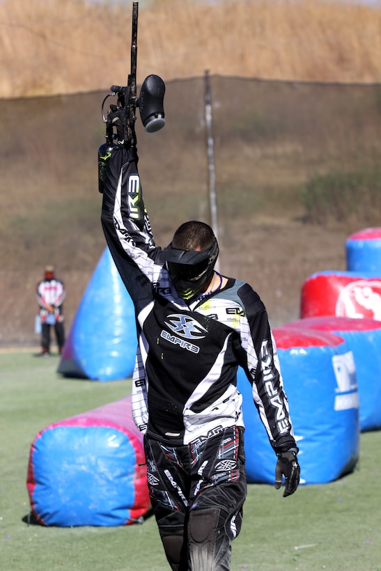 Dustin Moore, Combat RFT, Assault Craft Unit-5 raises his paintball gun to signal he has been eliminated from the match during the 2010 Pendleton Cup paintball tournament at Camp Pendleton, June 18. The teams that participated in this year’s paintball tournament included “Smash” and “Ball Bustaz” from Combat Logistics Battalion 1, “Red-Patchers” and “Kill-Patch” from Combat Logistics Regiment 17, “Combat RFT” from Assault Craft Unit 5, team Kill from 9th Communications Battalion, and “Edson Raiders” from Weapons Field Training Battalion.