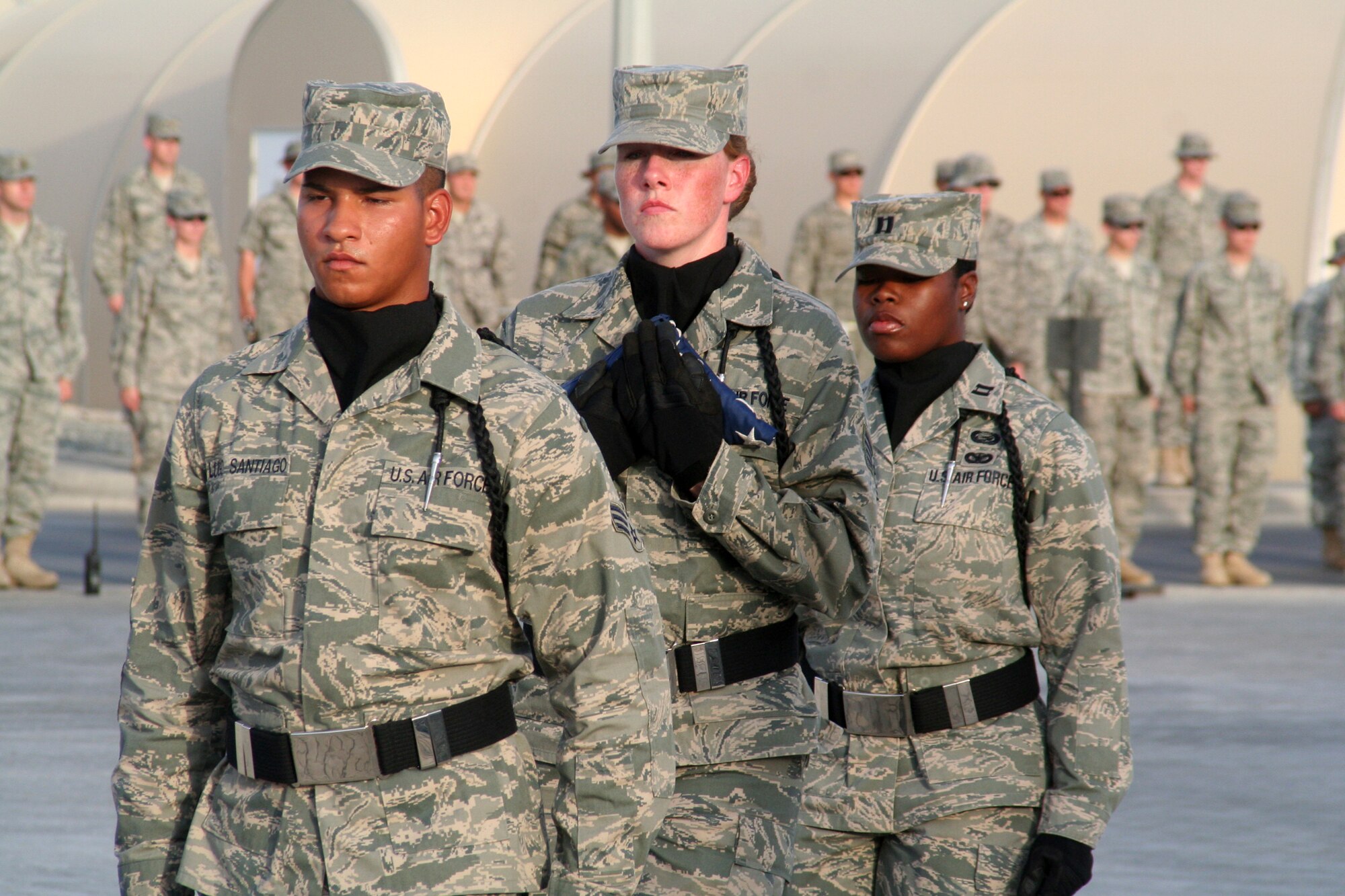 Airmen from the 380th Air Expeditionary Wing participate in a wing-wide retreat ceremony at a non-disclosed base in Southwest Asia on June 11, 2010. Every week the 380th AEW holds a retreat ceremony to honor the American flag and as part of a military tradition. During the June 11 ceremony, the 963rd Expeditionary Airborne Air Control Squadron served as the lead unit in formation. Airmen in the unit are deployed from Tinker Air Force Base, Okla. The 380th AEW supports operations Iraqi Freedom and Enduring Freedom and the Combined Joint Task Force-Horn of Africa. (U.S. Air Force Photo/Master Sgt. Scott T. Sturkol/Released)