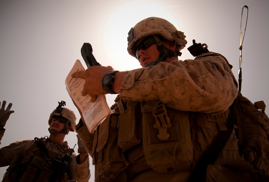 Lance Cpl. Cody J. Stickels, a radio operator with Lima Company, 3rd Battalion, 3rd Marine Regiment, prepares to call in a cache find during a patrol to the east of the company’s newly established observation post in Southern Shorsurak, Helmand province, Afghanistan, as part of Operation New Dawn, June 20, 2010. Operation New Dawn is a joint operation between Marine Corps units and the Afghanistan National Army to disrupt enemy forces, which have been using the sparsely populated region between Marjah and Nawa as a safe haven. (Official Marine Corps photo by Sgt. Mark Fayloga)