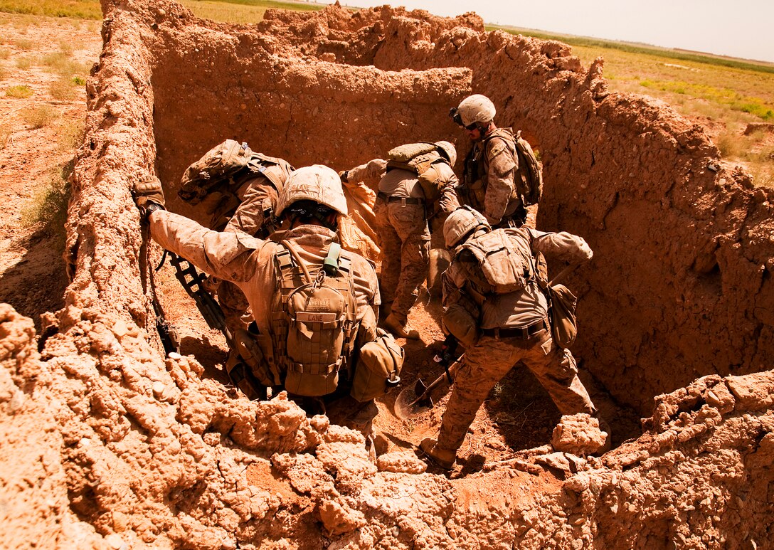 Marines from Company L, 3rd Battalion, 3rd Marine Regiment, uncover an improvised explosive device cache in an abandoned compound east of their newly established observation post in Southern Shorsurak, Helmand province, Afghanistan, during Operation New Dawn, June 20, 2010. The Marines found two directional fragmentation improvised explosive devices weighing 35 pounds each, 15 feet of detonation cord and 15 pounds of ammonium nitrate and aluminum powder. Operation New Dawn is a joint operation between Marine Corps units and the Afghanistan National Army to disrupt enemy forces, which have been using the sparsely populated region between Marjah and Nawa as a safe haven.