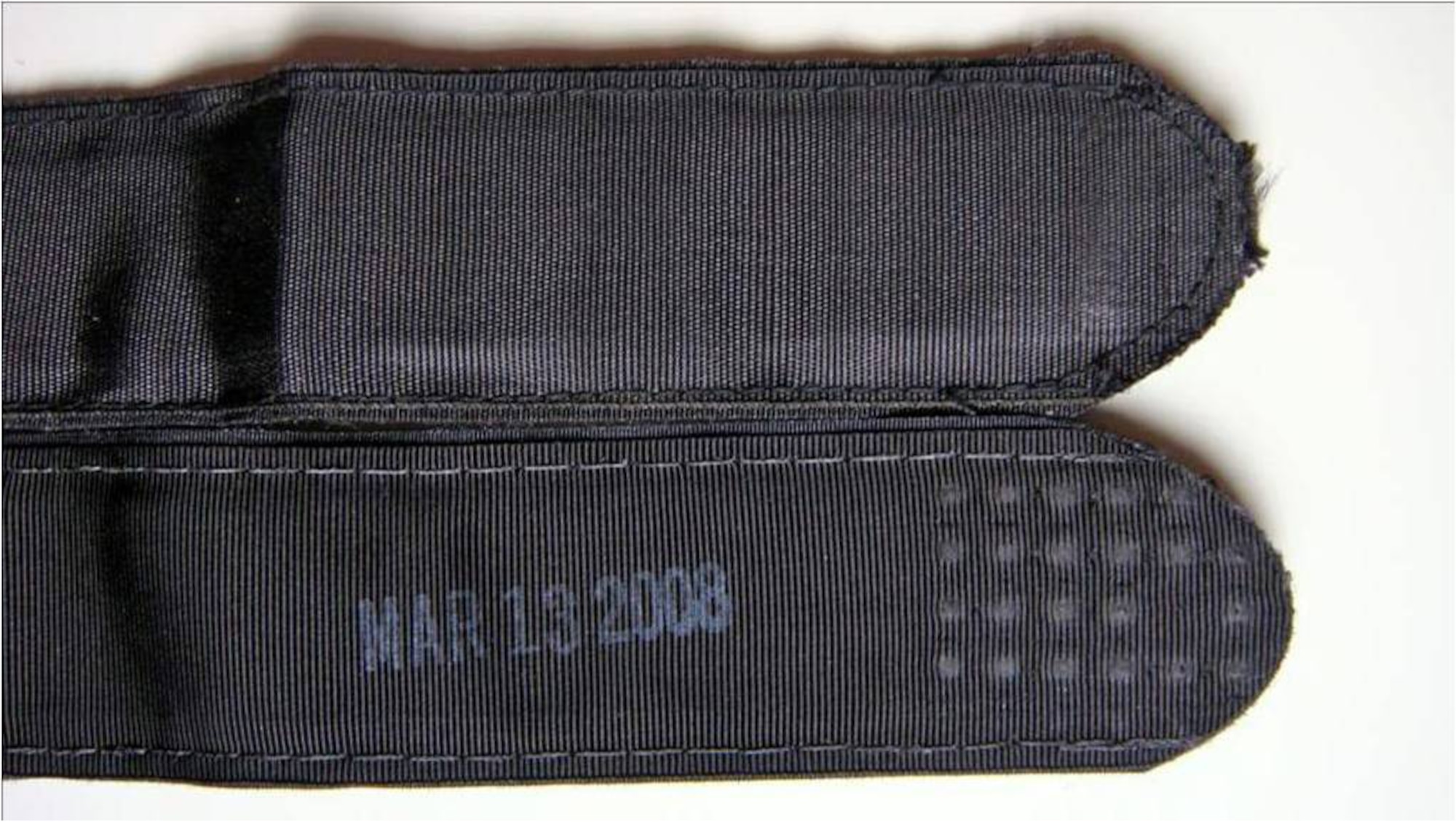 The authentic tourniquet has a manufacturing date stamped on it (bottom). (Courtesy photo)