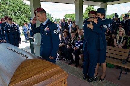 U.S. Air Force pararescueman past and present line up to pay respects to their fallen comrade Tech. Sgt. Michael Flores by leaving behind the flashes from their berets and rendering a final salute after the member's memorial service. Tech. Sgt. Michael Flores was assigned to the 48th Rescue Squadron, Davis-Monthan Air Force Base, Ariz.  and died June 9, near FOB Jackson, Afghanistan, in a HH-60G Pave Hawk helicopter crash.
(U.S. Air Force photo/Staff Sgt. Bennie J. Davis III)