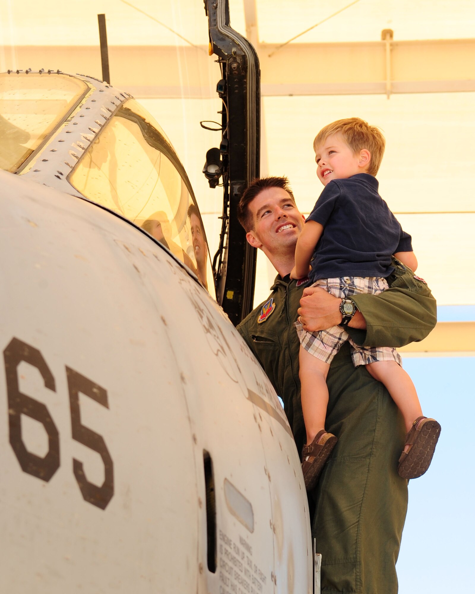 Maj. Sean Baerman holds his three-year-old son Teague, as he shows him the cockpit of an A-10 Thunderbolt II on the flight line here June 8. The major was one of 17 military officers selected by the George and Carol Olmsted Foundation to be a student in Olmsted Scholar Class of 2011. Major Baerman and his family will spend the next few years living in Buenos Aires as he completes a Masters of International Relations at the University of Belgrano. (U.S.Air Force photo/Airman 1st Class Jerilyn Quintanilla)