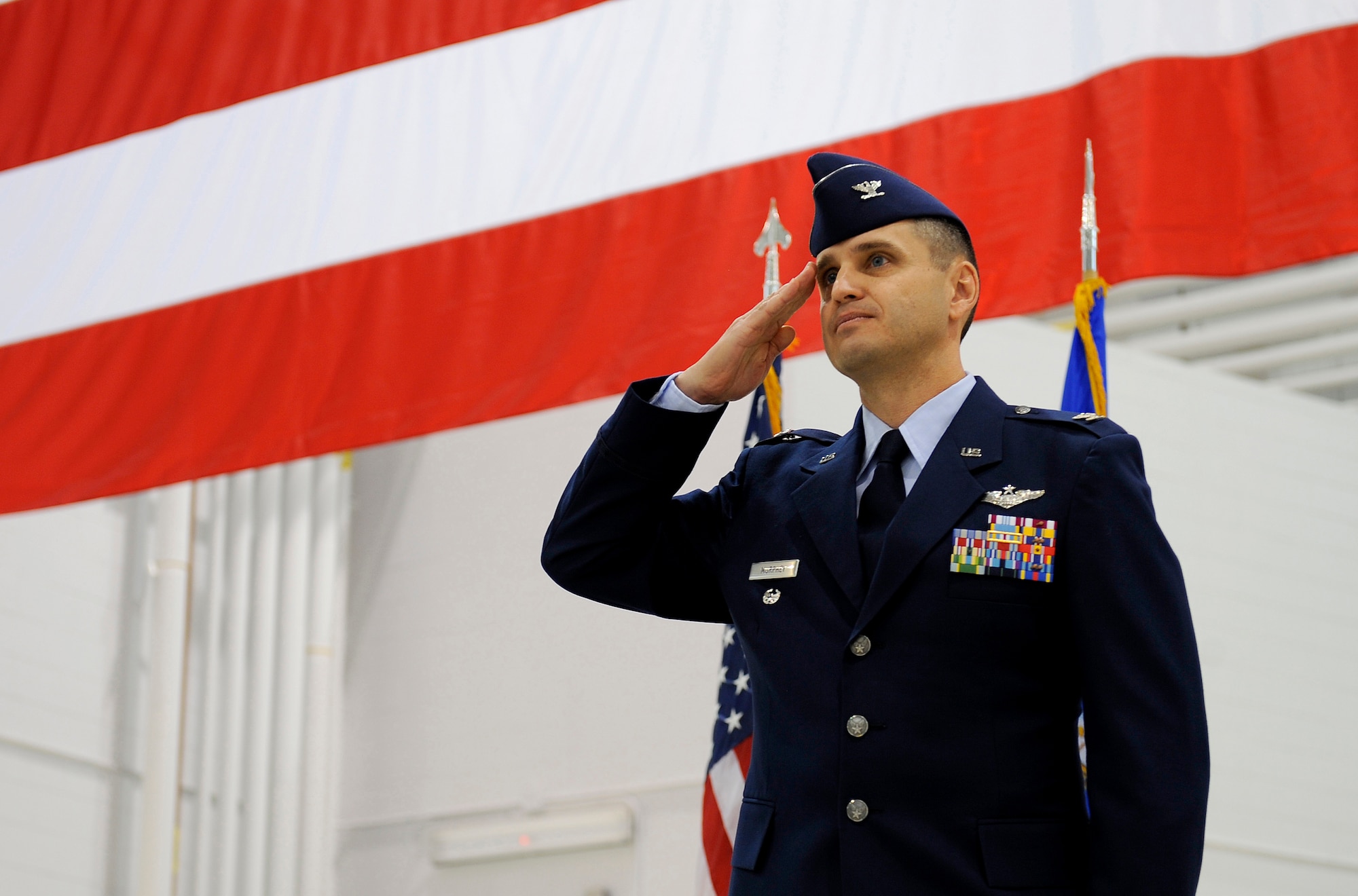 Col. William C. Murphey salutes Airman from the 715th Air Mobility Operations Group for the first time during a change of command at Joint Base Elmendorf-Richardson, June 17.  The change of command was the first official act for the group after its relocation from Hickam Air Force Base, Hawaii. (U.S. Air Force photo/Staff Sgt. Brian Ferguson)