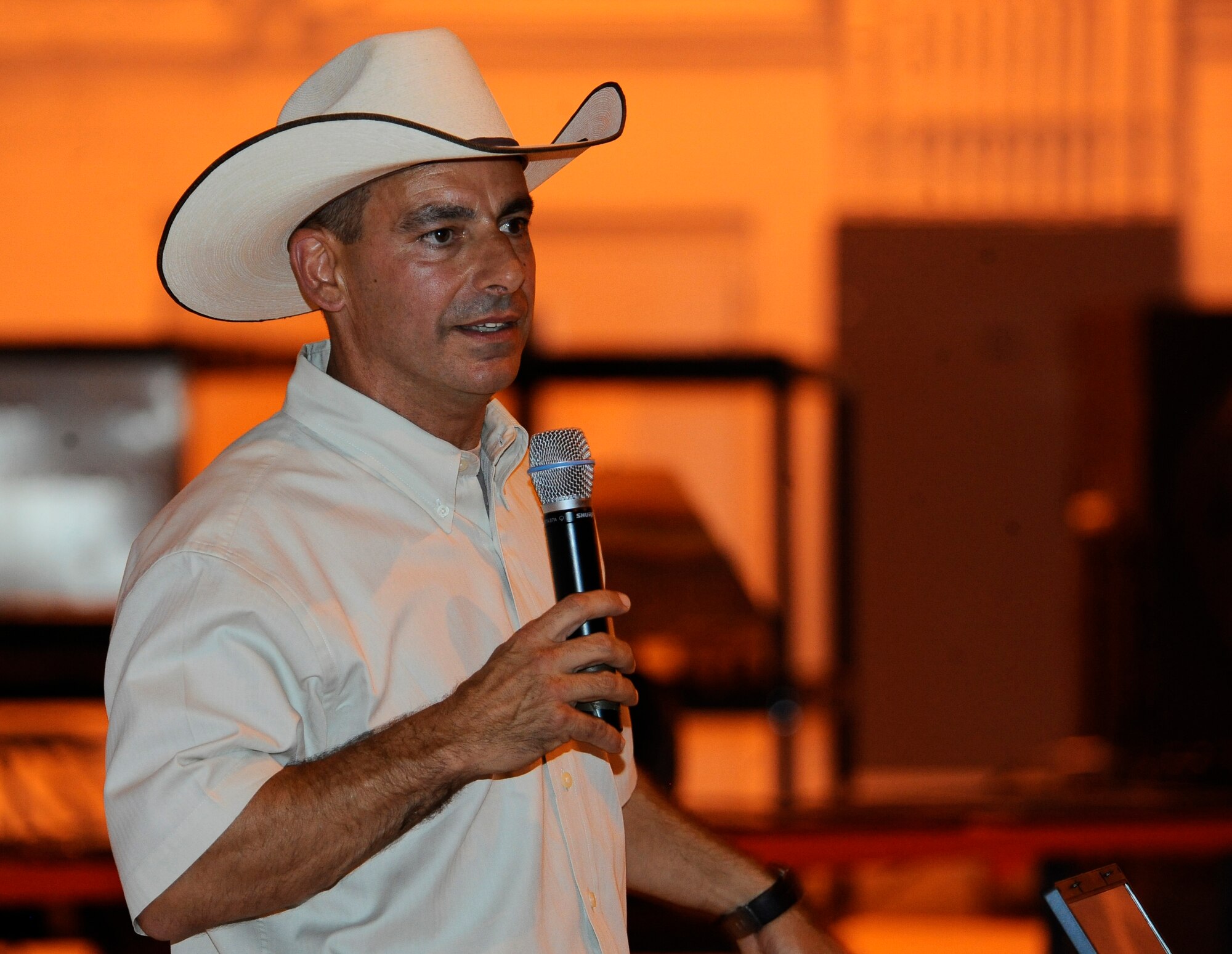 HOLLOMAN AIR FORCE BASE, N.M. -- Col. Jeff Harrigian, 49th Fighter Wing commander, shares his experiences as commander of Holloman during his "Cowboy Cook-Out" farewell dinner June 18, 2010. After a warm meal and dessert, Airmen and their families enjoyed live music and a dance floor to "boot scoot." (U.S. Air Force photo by Senior Airman Veronica Stamps / Released)