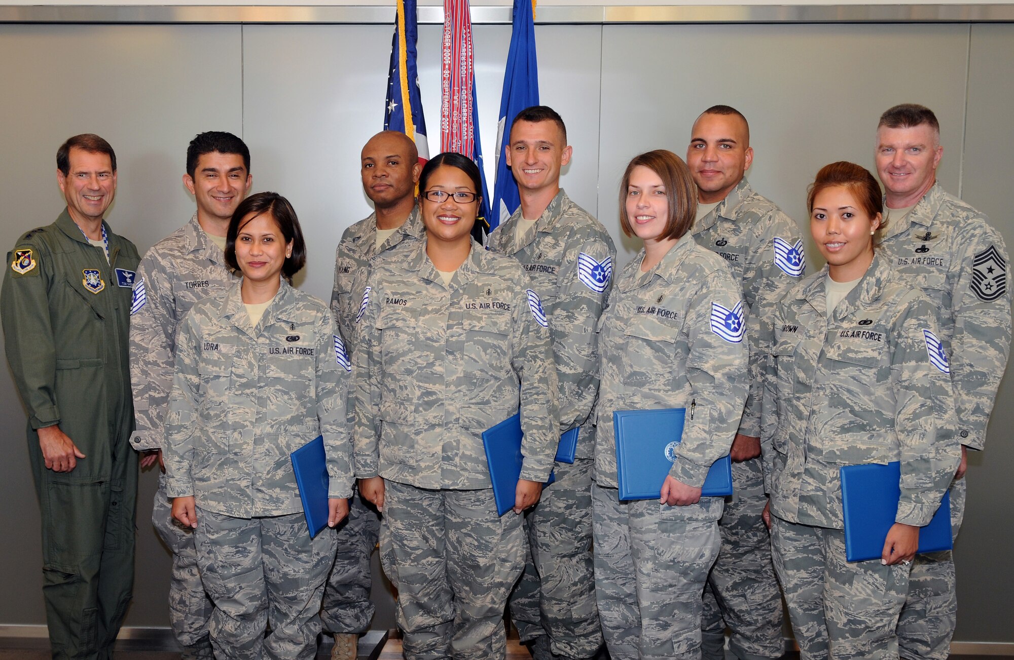 Los Angeles AFB’s newest tech sergeant selectees pose with SMC Commander, Lt. Gen. Tom Sheridan. The selectee list was announced June 17. Pictured from left to right are:   Lt. Gen. Sheridan, staff sergeants Francisco Torres, Rhea Lora, Tony Young, Allita Ramos, Salvator Demarti, Danielle McEachern, Columbus Campbell and Karla Brown, and Chief Master Sgt. Mark Repp. (Photo by Jim Gordon)