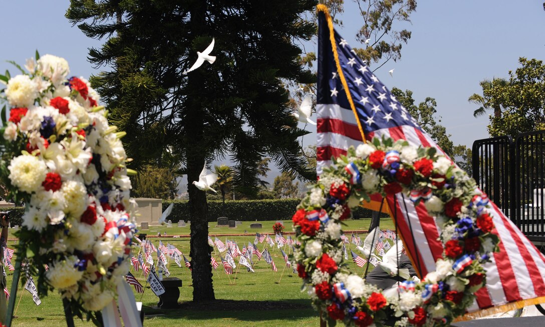 Doves take flight during the City of Santa Monica’s Memorial Day observance at Woodlawn Cemetery, May 31. (Photo by Joe Juarez)