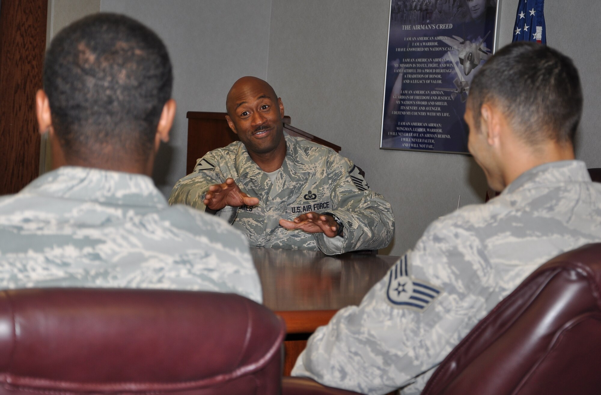 LAUGHLIN AIR FORCE BASE, Texas – Master Sgt. Kevin Holmes, 47th Mission Support Group first sergeant, advises enlisted personnel who were recently promoted to technical sergeant about what will be expected from them and what they can expect once their promotion is complete. A total of six Laughlin members were promoted to technical sergeant. (U.S. Air Force photo by Airman 1st Class Blake Mize) 