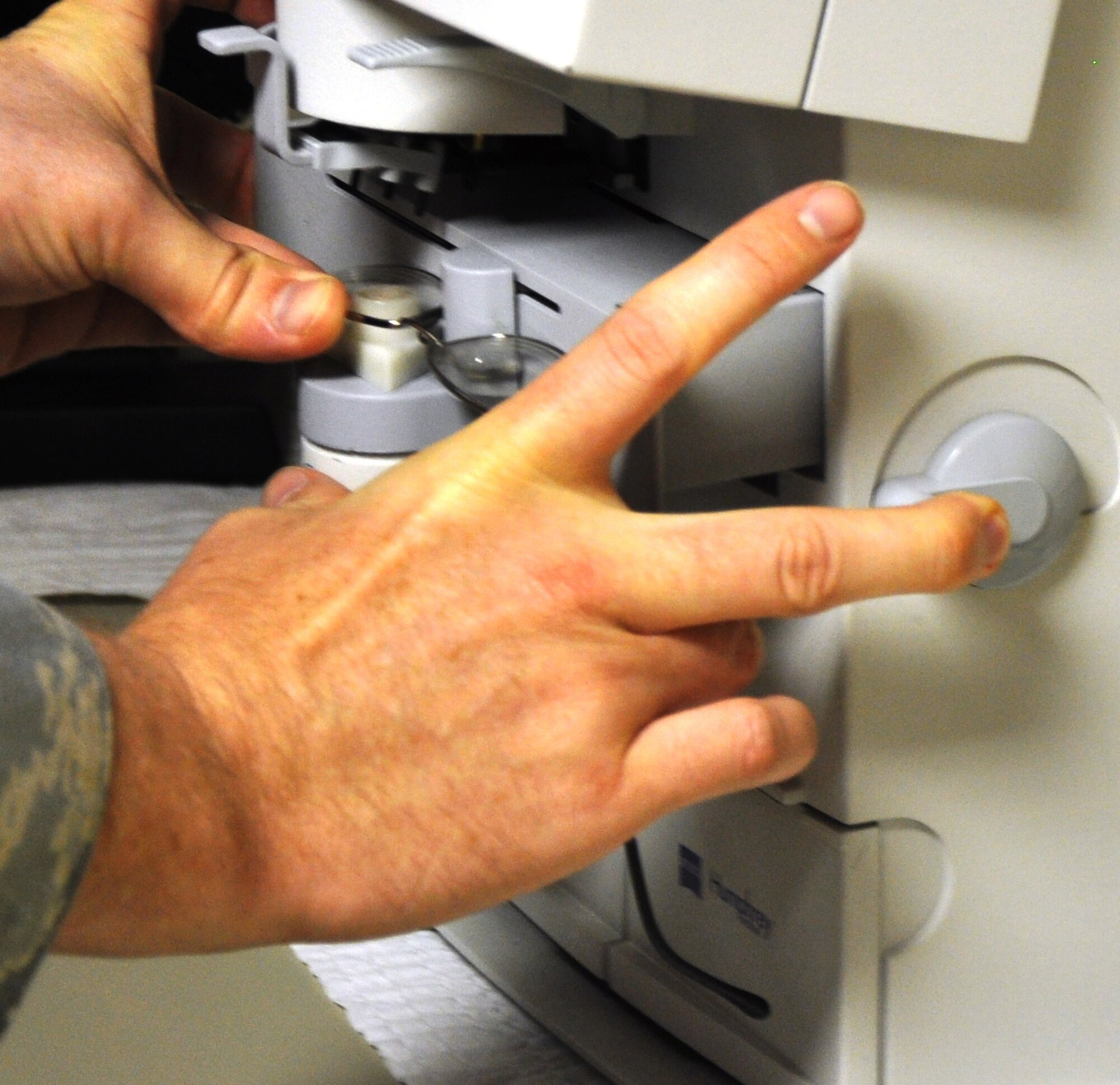 Students must use the auto-phoroptor to check the current prescription of a pair of lenses. Students are taught to use the patient’s current prescription and compare it with the new one they’ll receive during that visit. (U.S. Air Force photo/Airman 1st Class Valerie Hosea)