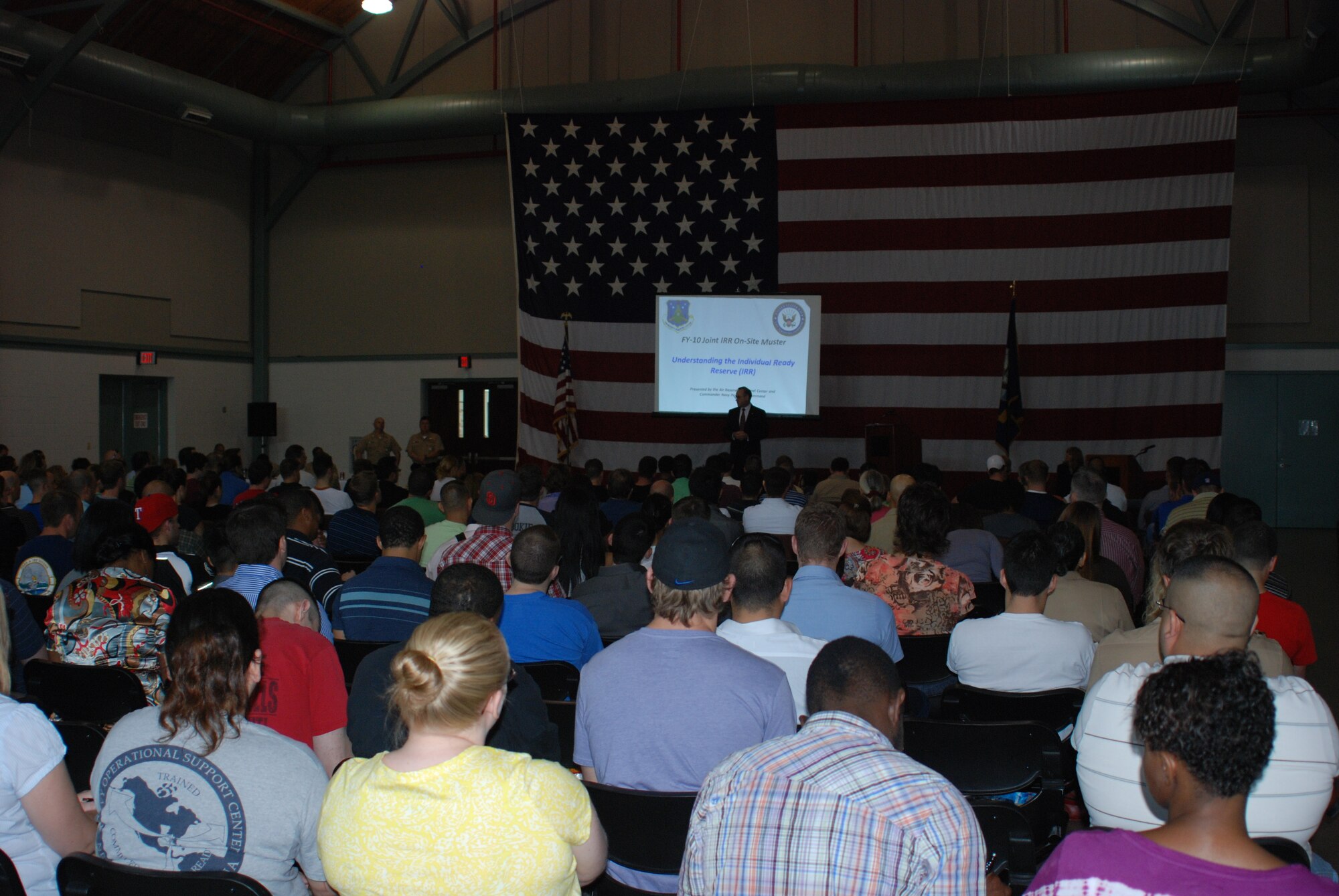 Guy Stratton (on stage), principal director, manpower and personnel, Office of
the Assistant Secretary of Defense (Reserve Affairs), Office of the Under
Secretary of Defense (Personnel and Readiness), Washington, D.C., addressed about 250 attendees June 12 at Naval Air Station Fort Worth Joint Reserve Base,
Texas, to show support for the first joint Reserve mass muster for the
Individual Ready Reserve.