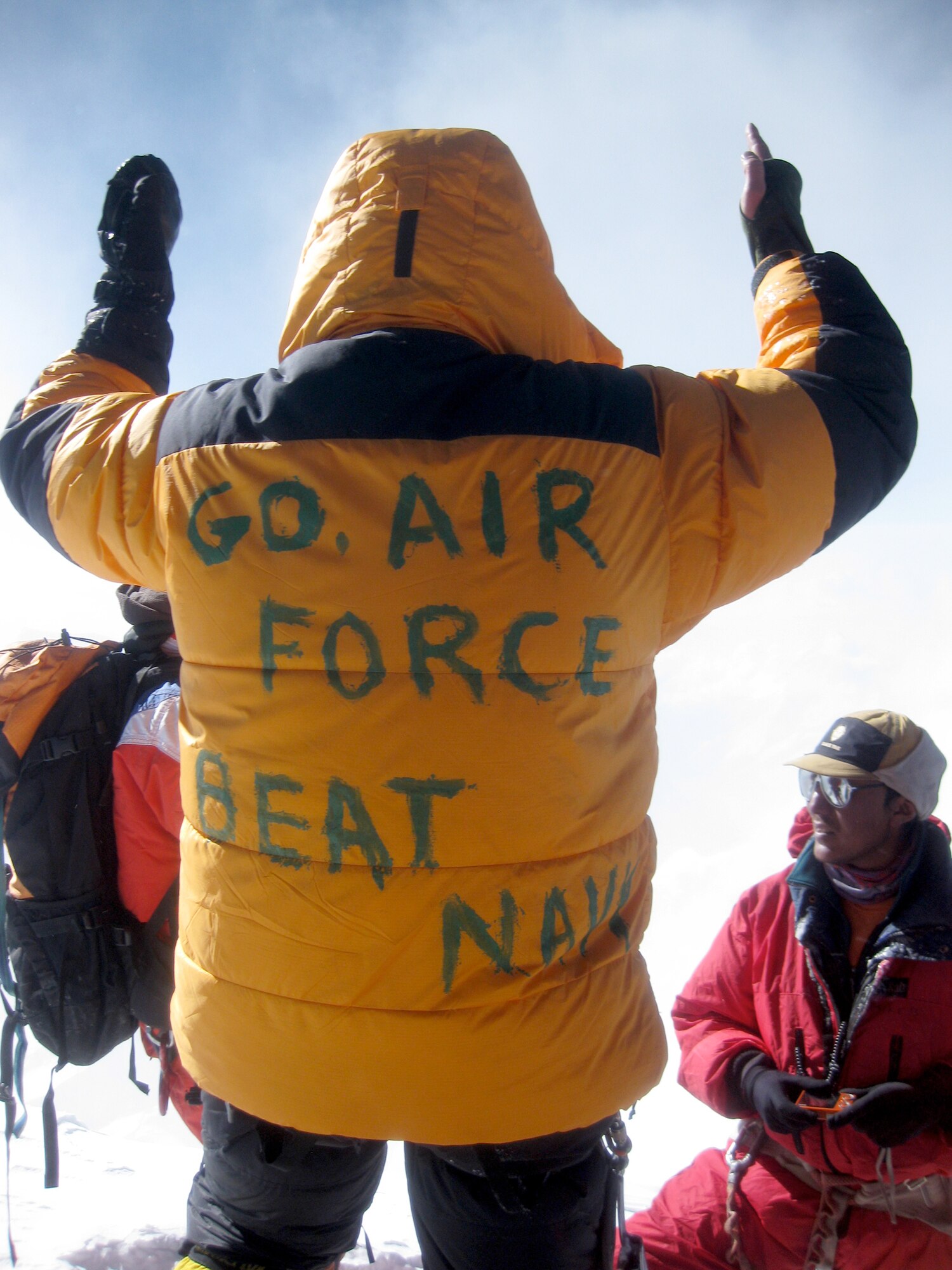 Lt. Col. Peter Solie celebrates at the summit of Mount Everest May 17, 2010, in Nepal. Colonel Solie unveiled his "rally cry" as other climbers unfurled their Navy SEALs flag. Colonel Solie is the Air Force Space Command Space Safety Division chief. (Courtesy photo)
