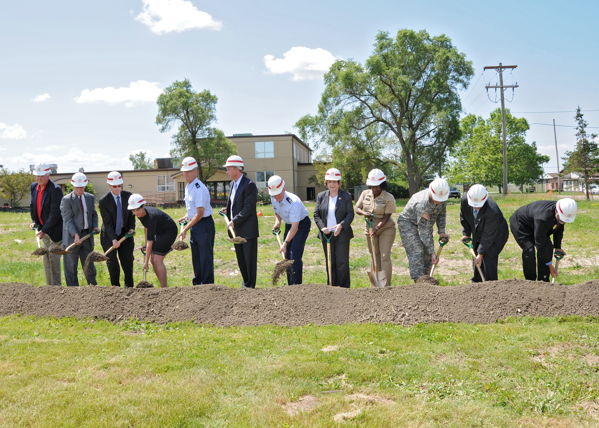 Western New York Servicemembers and Public Figures break the ground at the CAC groundbreaking ceremony, June 21, 2010, Niagara Falls Air Reserve Station, Niagara Falls, NY.  At the conclusion of the groundbreaking ceremony refreshments provided by NIMAC were prepared and served by the 914th Services Squadron. (U.S. Air Force photo by Staff Sgt. Joseph McKee