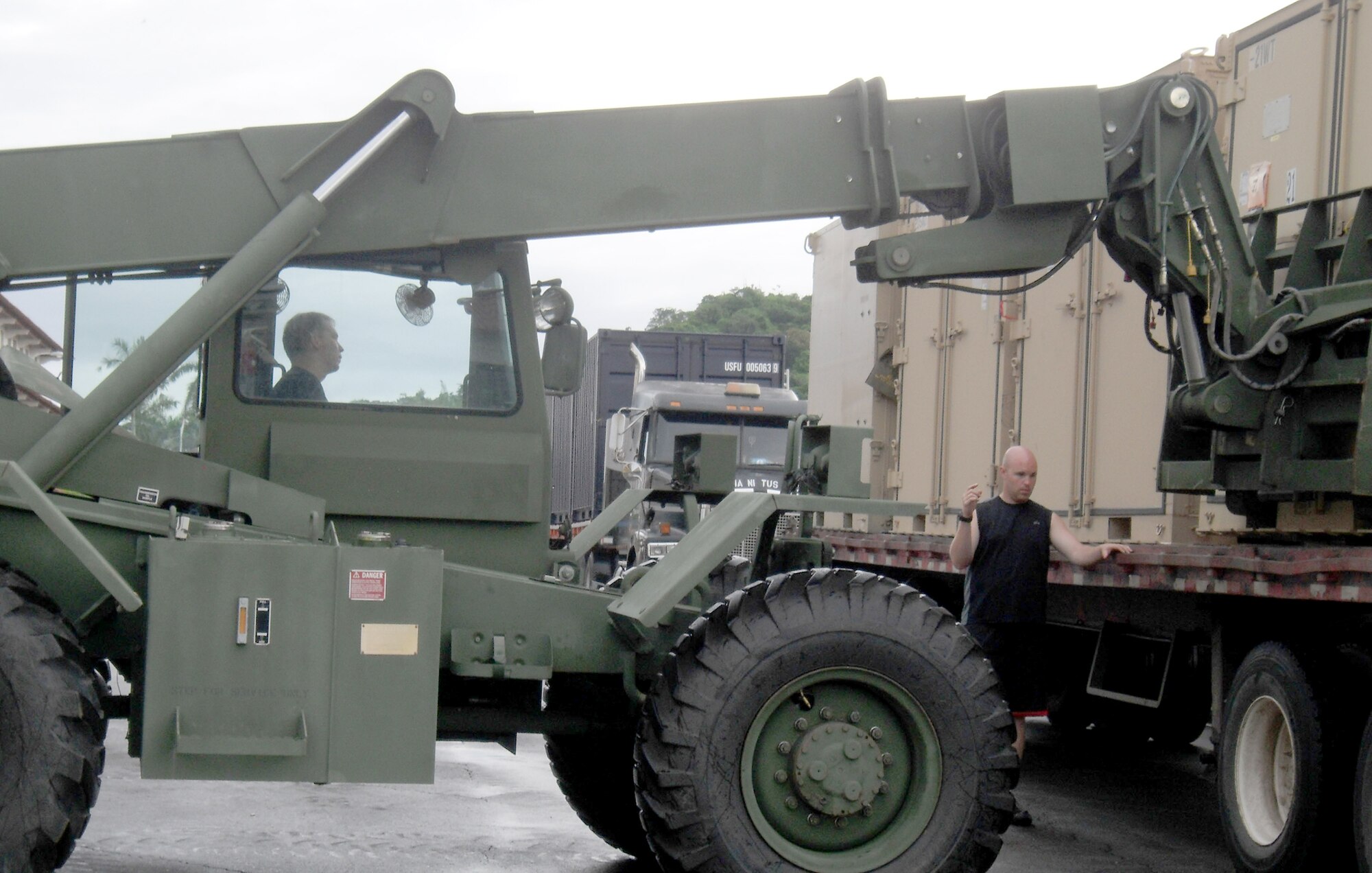 Airmen load the first shipment of materiel for New Horizons Panama 2010 onto trucks in Panama City. New Horizons Panama 2010 is a 12-week humanitarian assistance mission. (U.S. Air Force photo/Staff Sgt. Teresa Burger)