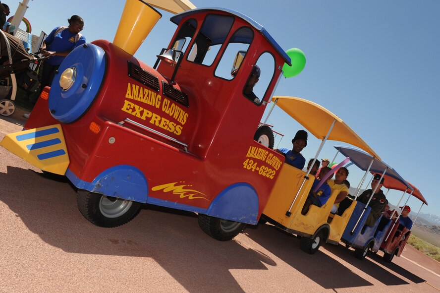 CREECH AFB, Nev. -- A train takes Creech Air Force Base family members around the base during the Creech Family Day event held here June 4. (U.S. Air Force photo/Senior Airman Brian Ybarbo)