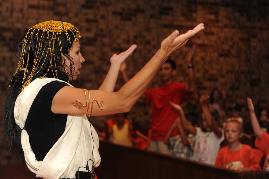 MOODY AIR FORCE BASE, Ga. -- Nichole Ellis, Vacation Bible School volunteer, sings a song while dancing in front of children during Vacation Bible School sponsored by the Base Chapel here June 16. Like Ms. Ellis, many members from around Moody and the surrounding community volunteered during the week-long event. (U.S. Ai r Force photo by Airman 1st Class Benjamin Wiseman/RELEASED)