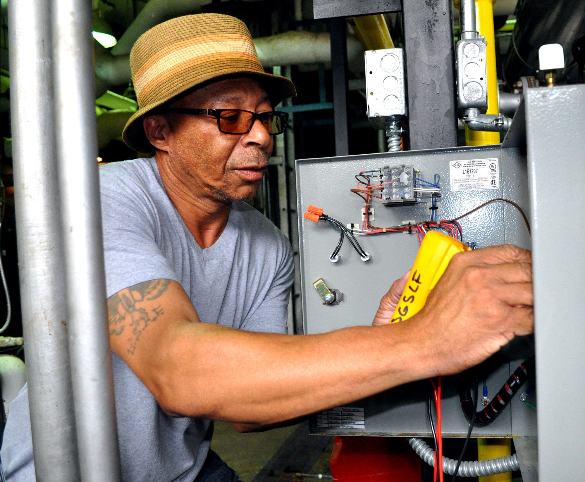 Tharwin Carr checks the voltage of a boiler at the Koritz Clinic June 15. Mr. Carr is a maintenance technician with the 14th MDSS. (U.S. Air Force photo/Senior Airman Jacob Corbin).