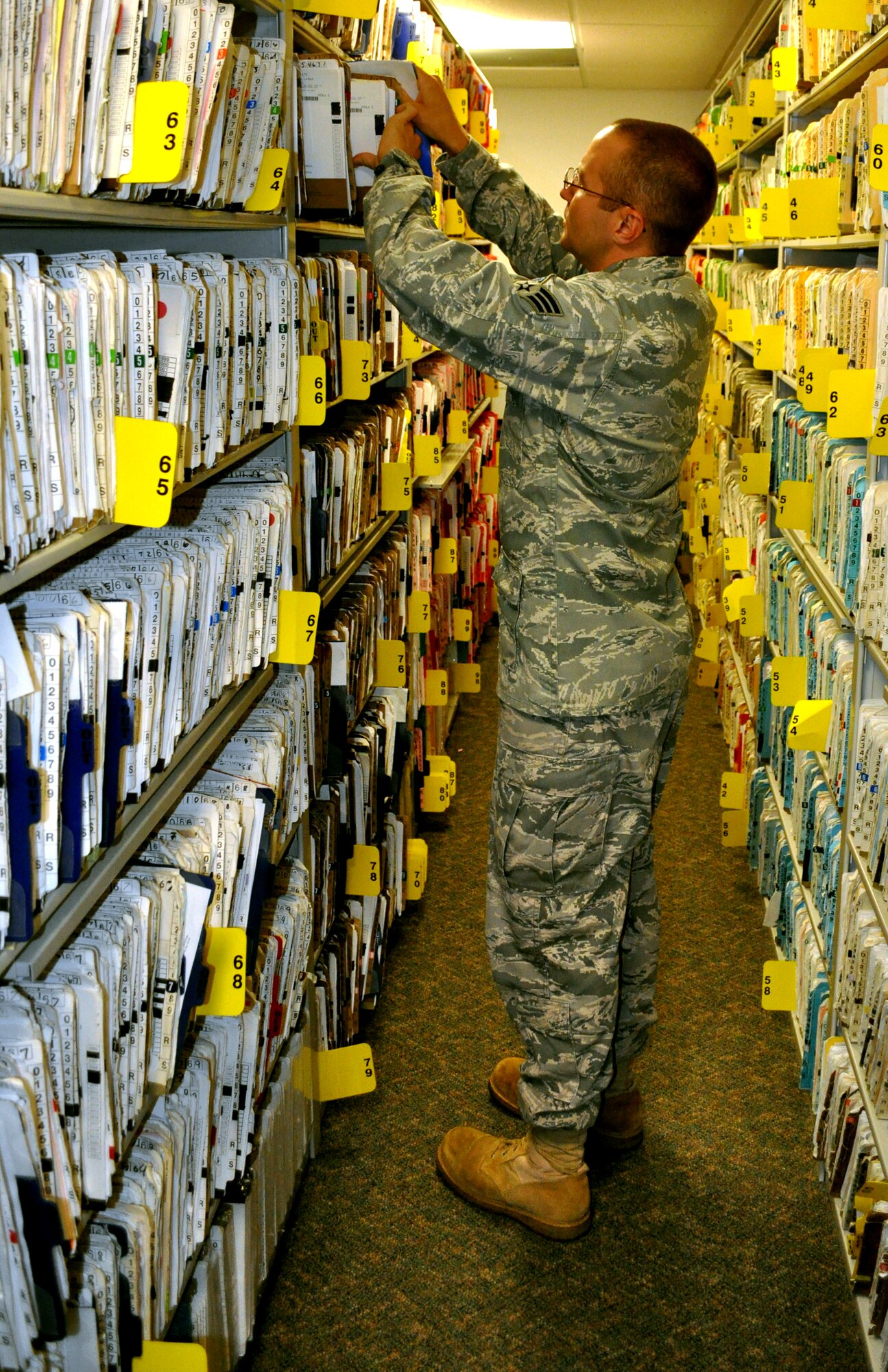 Senior Airman Kevin Jordan pulls a patient’s medical records at the Koritz Clinic June 15. Airman Jordan is an outpatient records technician with the 14th MDSS. (U.S. Air Force photo/Senior Airman Jacob Corbin).