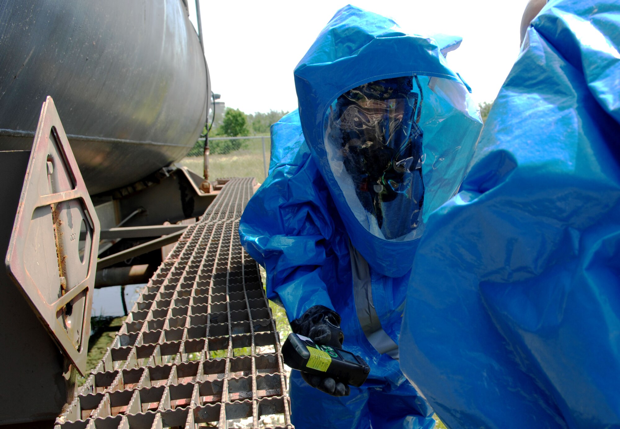 SCOTT AIR FORCE BASE, Ill. -- Airman 1st Class Tyler Haugland, Aerospace Medicine Squadron Bioenvironmental Flight technician, takes samples from a simulated chlorine and ethanol spill during an in-house exercise June 10. The exercise was put on by the flight to give technicians keep technicians familiar with their equipment and procedures. (U.S. Air Force photo by Senior Airman Samantha S. Crane)