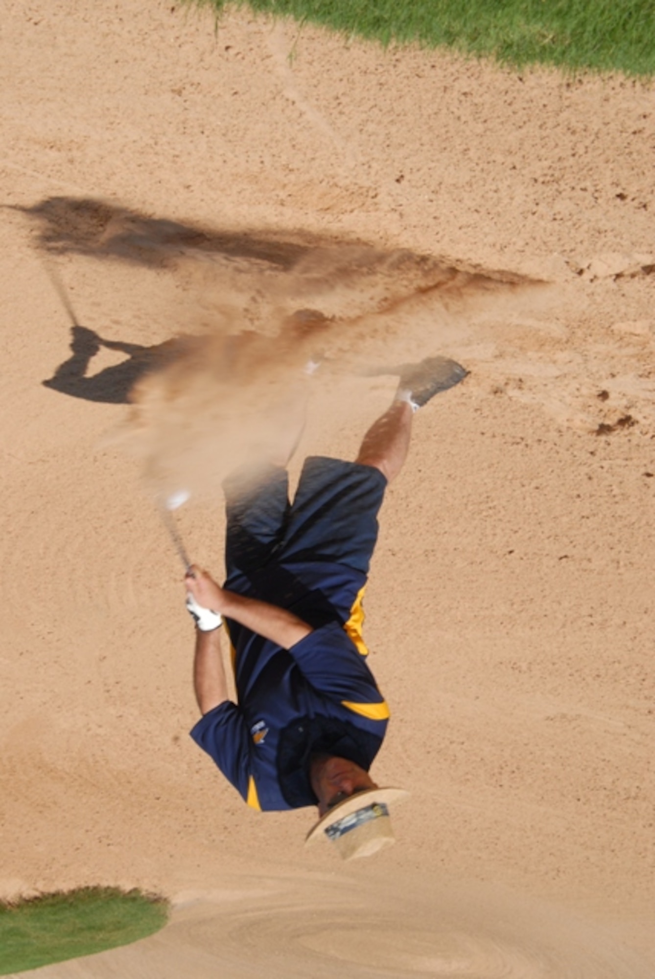 Lt. Col. Mike Rand, 315th Training Squadron, hits one out of the bunker at the 14th hole during the Sailor Booster Club annual golf tournament June 19 at the Quick Sands golf course. First place team was Ross Whitfield, Jackson Newberry, Wade Pinson and Slayton Strube. (U.S. Air Force photo/Connie Hempel)