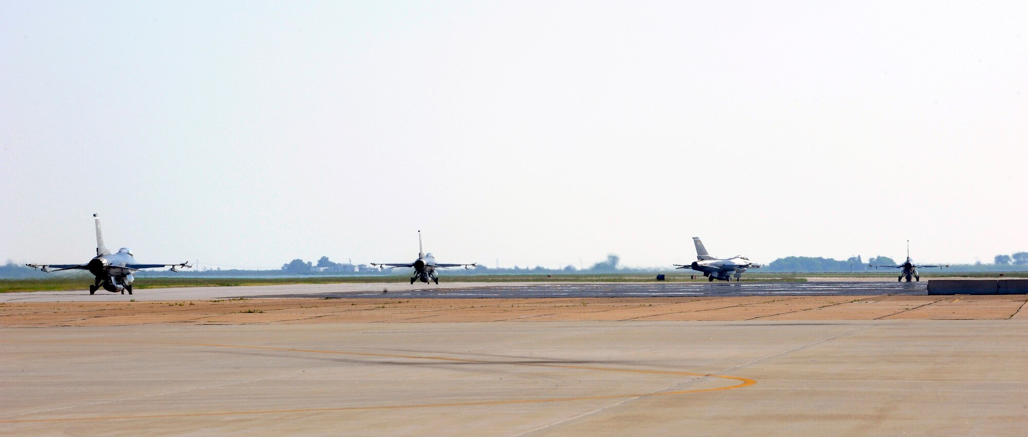 LANGLEY AIR FORCE BASE, Va. -- F-16 Fighting Falcons from the 62d Fighter Squadron taxi on the flight line June 10. The squadron is visiting from Luke AFB, Ariz., to provide adversary support, or “red air,” for the 1st Fighter Wing’s F-22 Raptor pilots. (U.S. Air Force photo/Senior Airman Dana Hill)