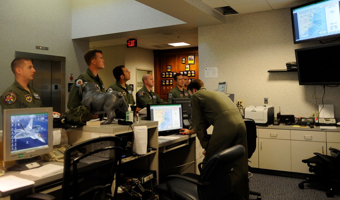 LANGLEY AIR FORCE BASE, Va. -- F-16 pilots from the 62d Fighter Squadron attend a pre-flight briefing June 10. The squadron is visiting from Luke AFB, Ariz., to provide adversary support, or “red air,” for the 1st Fighter Wing’s F-22 Raptor pilots. (U.S. Air Force photo/Senior Airman Dana Hill)