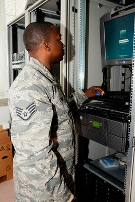 Staff Sgt. JaVonn Stone examines a monitor that displays network functions at the 127th Communications Squadron Network Control Center, June 19, 2010, at Selfridge Air National Guard Base. Stone and other computer specialists in the squadron work as part of a team to ensure that the computer system at Selfridge is reliable and secure. (U.S. Air Force photo by TSgt. Dave Kujawa) (RELEASED)
