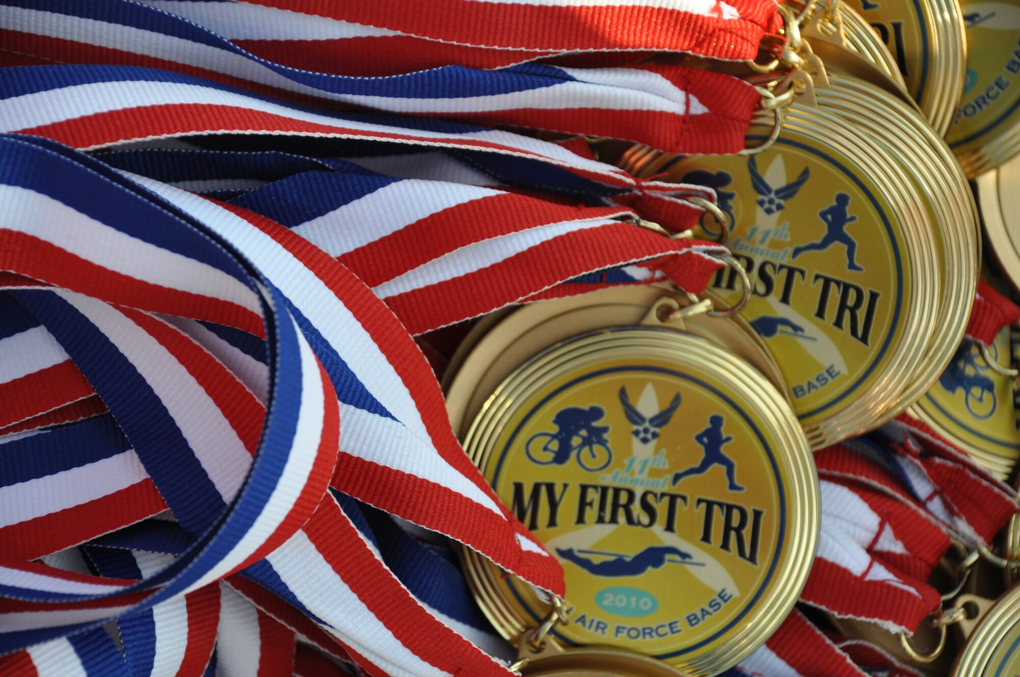 EGLIN AIR FORCE BASE, Fla. -- Everyone who participated in Eglin's 11th annual My First Tri June 19 received a medal and all results are listed on www.eventtiming.com. There were 337 athletes in the event and 181 of them participated for the first time. Each individual completed a 200-meter swim, an 8-mile bike ride and a 2.5 mile run. (Air Force photo/Chrissy Cuttita)