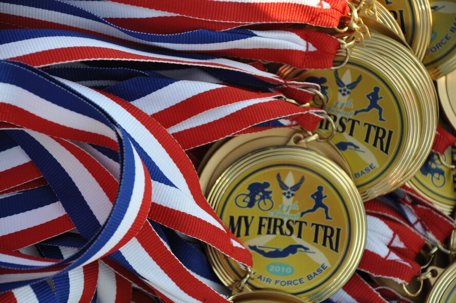 EGLIN AIR FORCE BASE, Fla. -- Everyone who participated in Eglin's 11th annual My First Tri June 19 received a medal and all results are listed on www.eventtiming.com. There were 337 athletes in the event and 181 of them participated for the first time. Each individual completed a 200-meter swim, an 8-mile bike ride and a 2.5 mile run. (Air Force photo/Chrissy Cuttita)