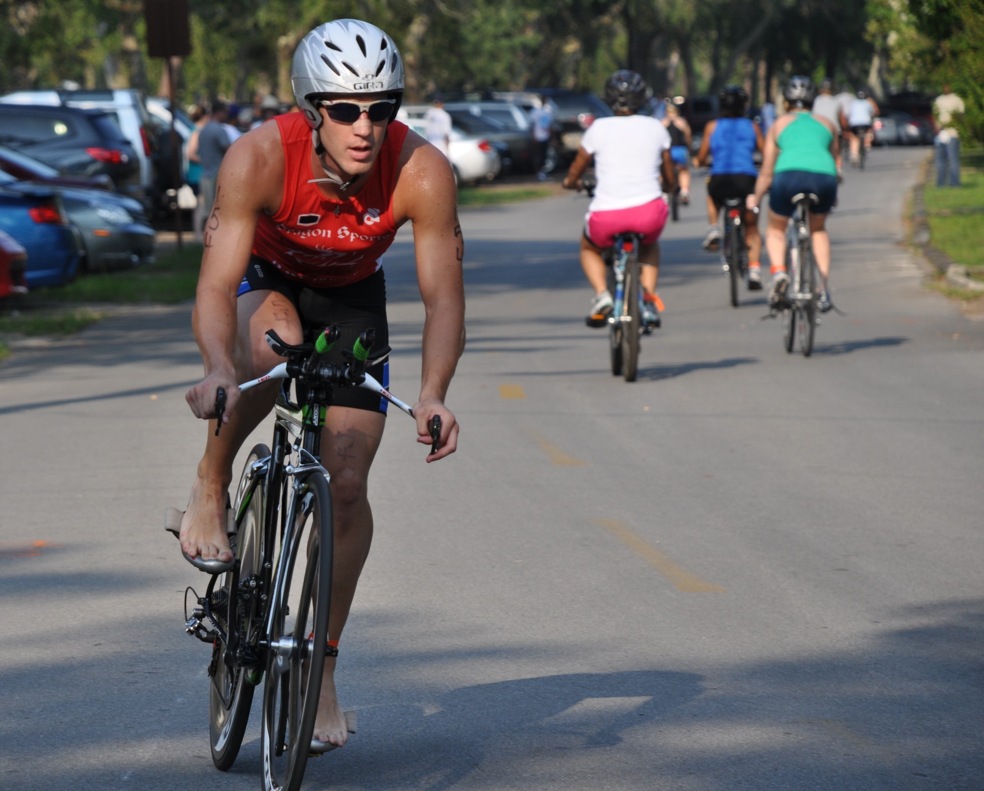 EGLIN AIR FORCE BASE, Fla. -- Mitchell Kieffer, second place male alumni overall, returns from the 8-mile bike trail during Eglin's 11th annual My First Tri June 19. There were 337 athletes in the event and 181 of them participated for the first time. Each individual completed a 200-meter swim, an 8-mile bike ride and a 2.5 mile run. Everyone received a medal and all results are listed on www.eventtiming.com. (Air Force photo/Chrissy Cuttita)