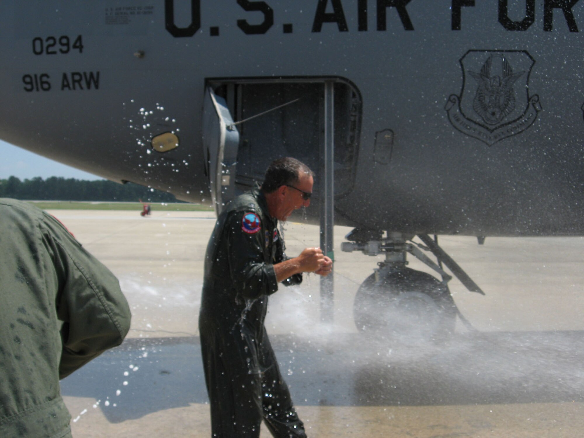 Lt. Col. William Uptmor gets soaked immediately following his last flight as the 911th Air Refueling Squadron commander. (USAF photo by Capt. Eric Babson, 911ARS)