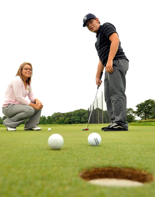 JOINT BASE ANDREWS, Md. -- Darlene Roach, a golf professional certified with the Professional Golfers Association of America, gives Kevin Lichte, The Course at Andrews food service manager, putting lessons during a lunch break here June 16. Ms. Roach is staffed at the course to provide golf lessons to golf course patrons both military and civilian. (U.S. Air Force photo by Bobby Jones)